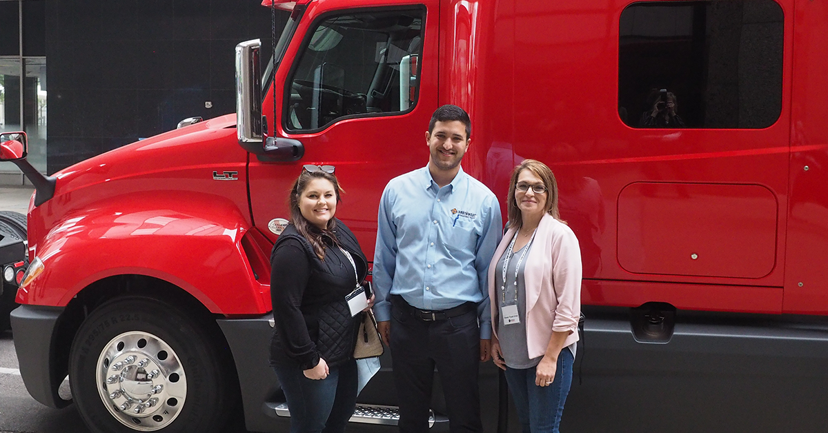 2021-three-conference-attendees-red-truck-1200x628