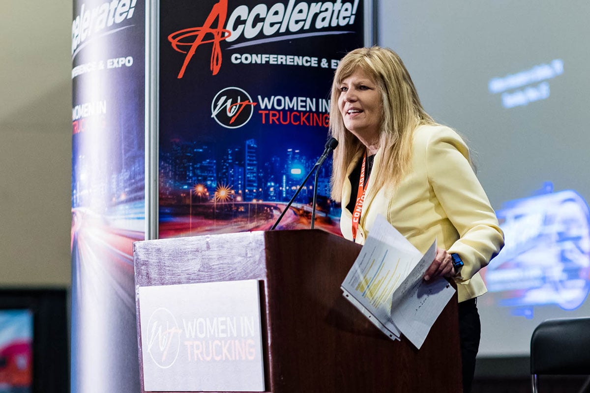 Ellen-Voie-Speaking-Podium-1200x800