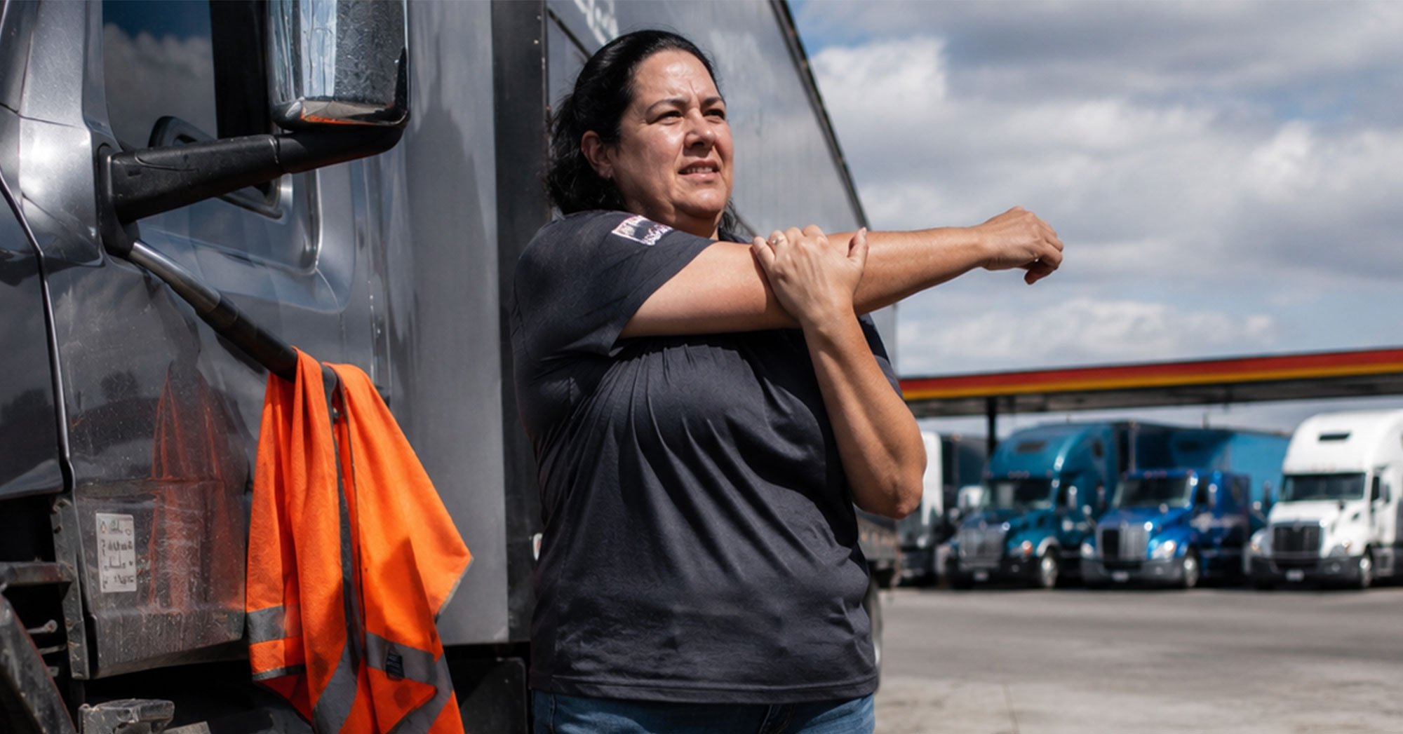 Female-Driver-Stretching-Outside-Truck-1200x628