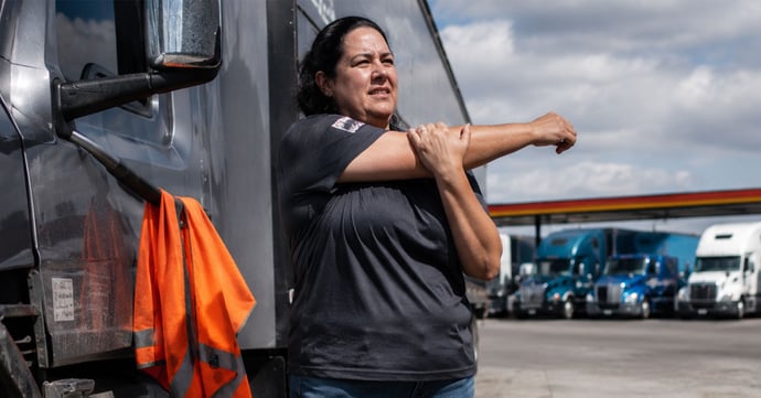 Female-Driver-Stretching-Outside-Truck-1200x628