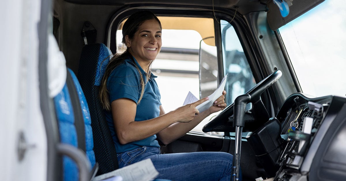 Happy-female-truck-driver-cab-1200x628