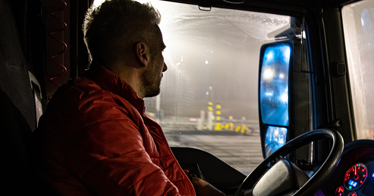 male-trucker-look-out-window-night-1200x628