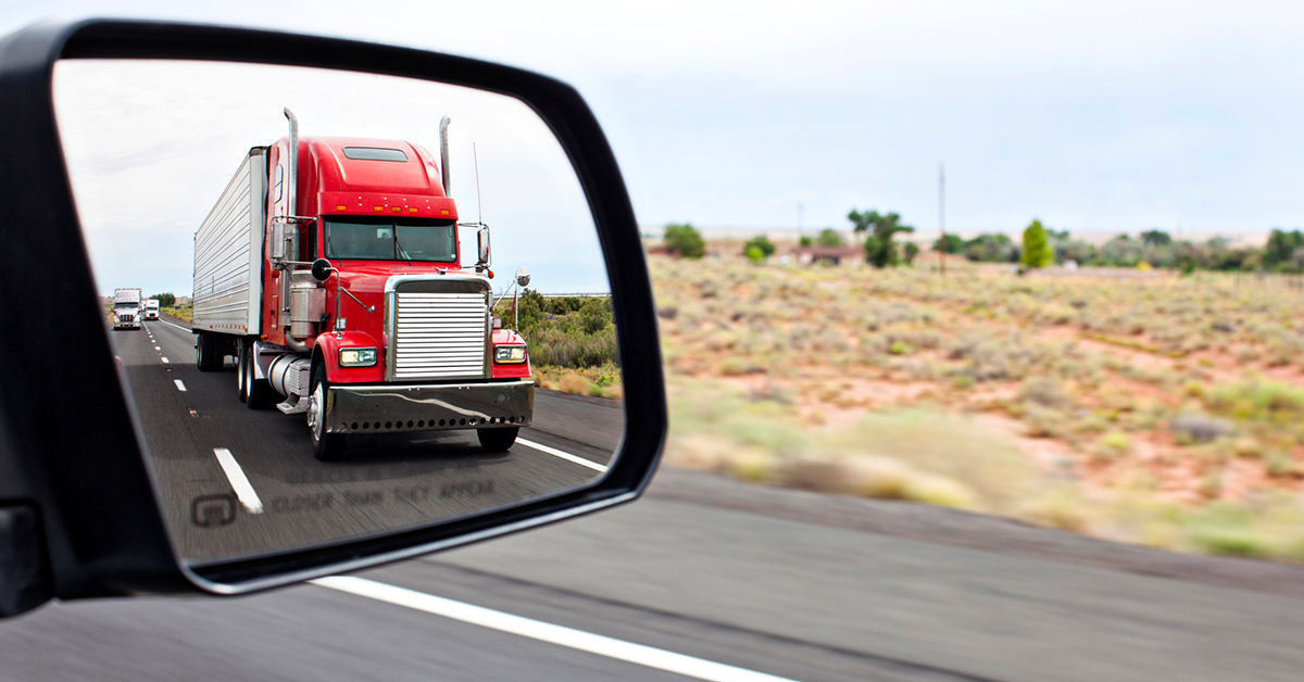 red-truck-mirror-highway-1200x628