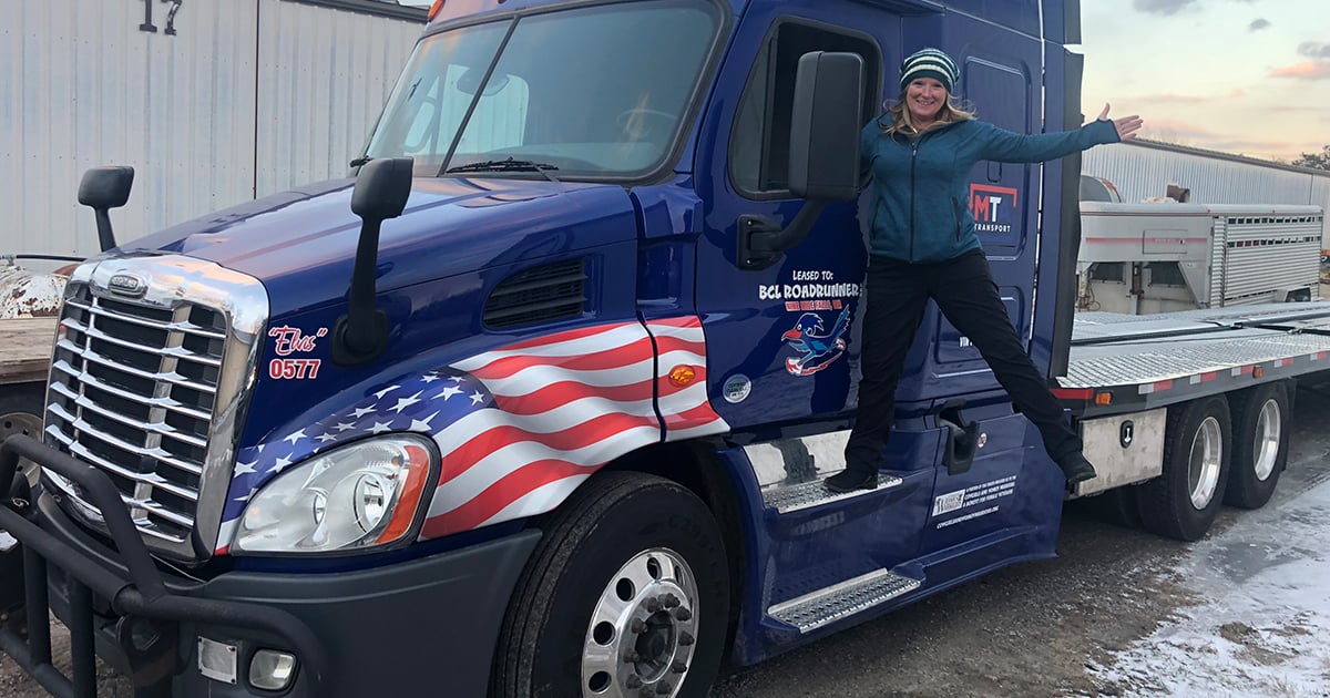 woman-standing-on-truck-1200