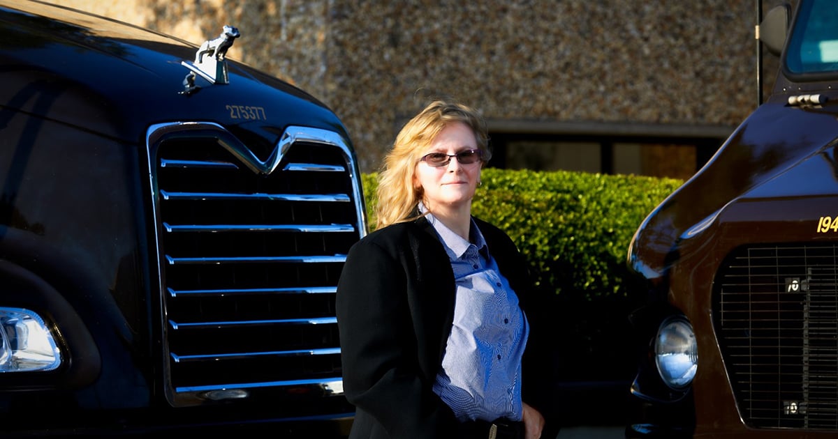 woman-standing-outside-truck-1200