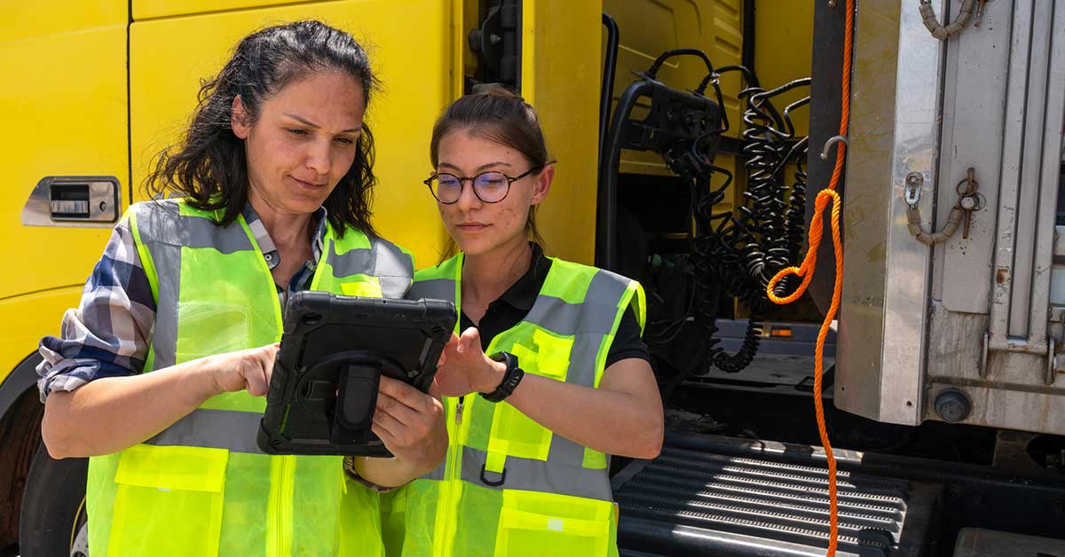 two-women-safety-vests-tech-check-1200x628
